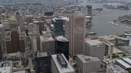 4.8K aerial stock footage of Downtown Baltimore skyscrapers, Inner Harbor in the background, Maryland Aerial Stock Footage | AX78_097E