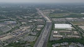 4.8K aerial stock footage approaching office buildings, light traffic on Interstate 95, and apartment buildings in Baltimore, Maryland Aerial Stock Footage | AX78_128E