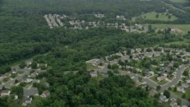 4.8K aerial stock footage flying over tract homes and trees in Abigdon, Maryland Aerial Stock Footage | AX78_145