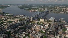 4.8K aerial stock footage of Benjamin Franklin Bridge spanning the Delaware River between Philadelphia, Pennsylvania and Camden, New Jersey Aerial Stock Footage | AX79_023