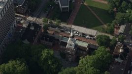 4.8K aerial stock footage tilting to a bird's eye view of Independence Hall and Chestnut Street, Philadelphia, Pennsylvania Aerial Stock Footage | AX79_034