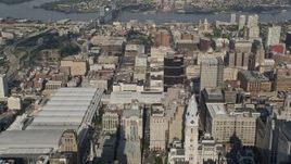 4.8K aerial stock footage flying over convention center and office buildings, approaching Benjamin Franklin Bridge, Downtown Philadelphia, Pennsylvania Aerial Stock Footage | AX79_055