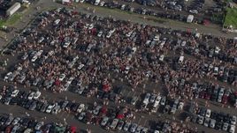 4.8K aerial stock footage of crowds tailgaiting  in a parking lot, Campbell's Field, Camden, New Jersey Aerial Stock Footage | AX79_091E