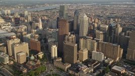 4.8K aerial stock footage approaching City Hall and skyscrapers in Downtown Philadelphia, Pennsylvania, Sunset Aerial Stock Footage | AX80_016E
