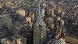 4.8K aerial stock footage tilting to bird's eye of One and Two Liberty Place in Downtown Philadelphia, Pennsylvania, Sunset Aerial Stock Footage | AX80_018