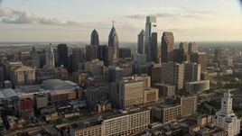4.8K aerial stock footage approaching Downtown Philadelphia skyscrapers and high-rises in Pennsylvania, Sunset Aerial Stock Footage | AX80_033