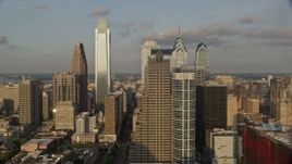 4.8K aerial stock footage flying by Downtown Philadelphia skyscrapers, Pennsylvania, Sunset Aerial Stock Footage | AX80_044E