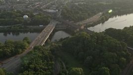 4.8K aerial stock footage approaching Girard Bridge spanning the Schuylkill River in Philadelphia, Pennsylvania, Sunset Aerial Stock Footage | AX80_053