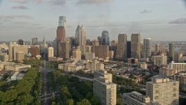 4.8K aerial stock footage approaching Philadelphia City Hall and skyscrapers in Downtown Philadelphia, Pennsylvania, Sunset Aerial Stock Footage | AX80_056