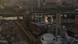 4.8K aerial stock footage of Veolia Energy power plant in South Philadelphia, Pennsylvania, Sunset Aerial Stock Footage | AX80_088