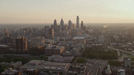 4.8K aerial stock footage of Downtown Philadelphia skyscrapers at sunset in Pennsylvania Aerial Stock Footage | AX80_099