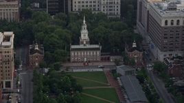 4.8K aerial stock footage approaching Old City Hall and Independence Hall, Downtown Philadelphia, Pennsylvania, Sunset Aerial Stock Footage | AX80_100