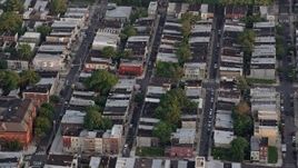 4.8K aerial stock footage of row houses and city streets in South Philadelphia, Pennsylvania, Sunset Aerial Stock Footage | AX80_107