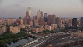 4.8K aerial stock footage of Downtown Philadelphia skyline seen from Schuylkill River, Pennsylvania, Sunset Aerial Stock Footage | AX80_123