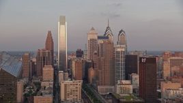 4.8K aerial stock footage flying by Downtown Philadelphia skyline, reveal Cira Centre, Pennsylvania, Sunset Aerial Stock Footage | AX80_124E
