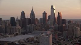 4.8K aerial stock footage approaching tall skyscrapers in Downtown Philadelphia, Pennsylvania, Sunset Aerial Stock Footage | AX80_142