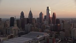 4.8K aerial stock footage flying by tall skyscrapers in Downtown Philadelphia skyline, Pennsylvania, Sunset Aerial Stock Footage | AX80_143