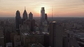 4.8K aerial stock footage flying by Downtown Philadelphia skyscrapers to reveal setting sun, Pennsylvania Aerial Stock Footage | AX80_150E