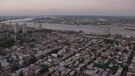 4.8K aerial stock footage flying over South Philly to approach Delaware River and Camden, New Jersey, Sunset Aerial Stock Footage | AX80_159