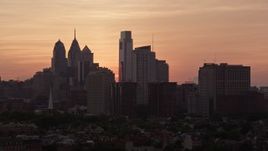 4.8K aerial stock footage of the Downtown Philadelphia skyline, eclipsed by condo complex, Pennsylvania, Sunset Aerial Stock Footage | AX80_161