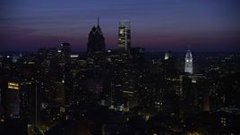 4.8K aerial stock footage flying by skyscrapers near city hall in Downtown Philadelphia, Pennsylvania, Night Aerial Stock Footage | AX81_017E