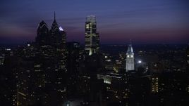 4.8K aerial stock footage of Downtown Philadelphia's tall skyscrapers and the City Hall clock tower, Pennsylvania, Night Aerial Stock Footage | AX81_019