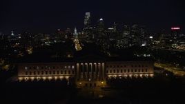 4.8K aerial stock footage approach and fly over Philadelphia Museum of Art, Downtown Philadelphia skyline in the background, Pennsylvania, Night Aerial Stock Footage | AX81_034E