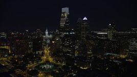 4.8K aerial stock footage following Benjamin Franklin Parkway toward City Hall and Downtown Philadelphia skyline, Pennsylvania, Night Aerial Stock Footage | AX81_036E