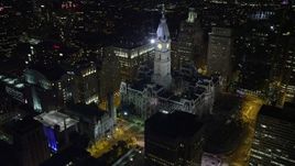 4.8K aerial stock footage approach and orbit Philadelphia City Hall in Downtown Philadelphia, Pennsylvania, Night Aerial Stock Footage | AX81_038E