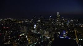 4.8K aerial stock footage fly away from Philadelphia City Hall to reveal Downtown Philadelphia skyscrapers, Pennsylvania, Night Aerial Stock Footage | AX81_040E