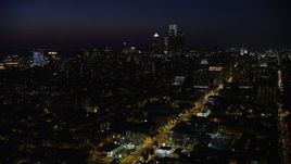 4.8K aerial stock footage of Downtown Philadelphia skyline and Broad Street leading to City Hall, Pennsylvania, Night Aerial Stock Footage | AX81_045