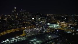 4.8K aerial stock footage of orbit bridges over the Schuylkill River by Cira Centre, I-76 and train yard, reveal Downtown Philadelphia, Pennsylvania, Night Aerial Stock Footage | AX81_050E