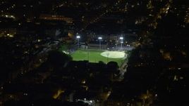 4.8K aerial stock footage of baseball field in an urban neighborhood in South Philadelphia, Pennsylvania, Night Aerial Stock Footage | AX81_060