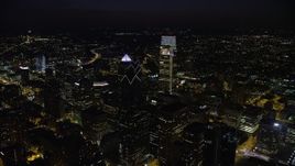 4.8K aerial stock footage flying over Downtown Philadelphia's tall skyscrapers to reveal Philadelphia Museum of Art, Pennsylvania, Night Aerial Stock Footage | AX81_064