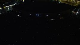 4.8K aerial stock footage tilting to a bird's eye view of a music concert at BB&T Pavilion, Camden, New Jersey Night Aerial Stock Footage | AX81_087