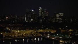 4.8K aerial stock footage of Downtown Philadelphia skyline, reveal The Residences at Dockside condo complex, Pennsylvania, Night Aerial Stock Footage | AX81_093