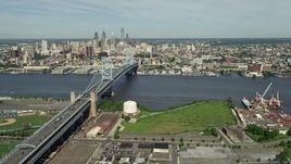 4.8K aerial stock footage of Benjamin Franklin Bridge spanning the Delaware River near the Downtown Philadelphia skyline, Pennsylvania Aerial Stock Footage | AX82_002