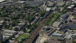 4.8K aerial stock footage tilting from train tracks in North Philly, and reveal Downtown Philadelphia skyline, Pennsylvania Aerial Stock Footage | AX82_025