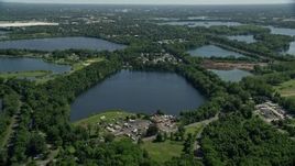 4.8K aerial stock footage flying over small lakes and lakeside homes in Morrisville, Pennsylvania Aerial Stock Footage | AX82_055