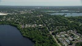 4.8K aerial stock footage flying over a mobile home park near a lake in Morrisville, Pennsylvania Aerial Stock Footage | AX82_056