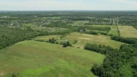 4.8K aerial stock footage of rural homes and green fields, Franklin Park, New Jersey Aerial Stock Footage | AX83_040