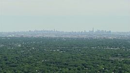 4.8K aerial stock footage of a distant view of Lower and Midtown Manhattan, New York seen from New Jersey  Aerial Stock Footage | AX83_062