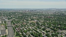 4.8K aerial stock footage flying over suburban homes by I-78 to approach Downtown Newark, New Jersey Aerial Stock Footage | AX83_075