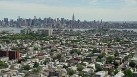 4.8K aerial stock footage of Midtown Manhattan skyline seen from Jersey City urban neighborhoods, New Jersey & New York Aerial Stock Footage | AX83_106E