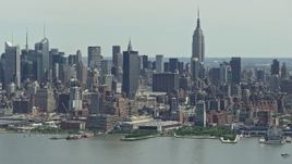4.8K aerial stock footage of Midtown Manhattan skyline and Hudson Yards seen from Hudson River, New York City Aerial Stock Footage | AX83_109