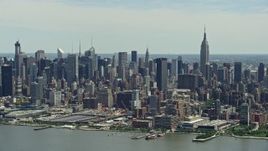 4.8K aerial stock footage of West Side Yard, Hudson Yards, and Midtown Manhattan skyscrapers seen from Hudson River, New York City Aerial Stock Footage | AX83_110