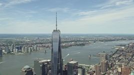 4.8K aerial stock footage of One World Trade Center tilt down to reveal World Trade Center Memorial, Lower Manhattan, New York City Aerial Stock Footage | AX83_163