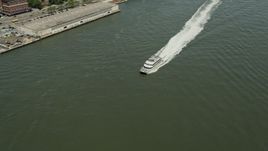4.8K aerial stock footage tracking a ferry cruising on the East River, New York City Aerial Stock Footage | AX83_181