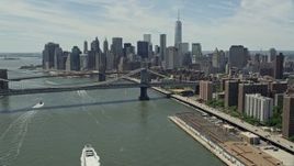 4.8K aerial stock footage of Brooklyn and Manhattan Bridges, and the Lower Manhattan skyline, New York City Aerial Stock Footage | AX83_182