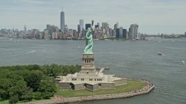 4.8K aerial stock footage orbiting Statue of Liberty and reveal Lower Manhattan skyline, New York City Aerial Stock Footage | AX83_194E